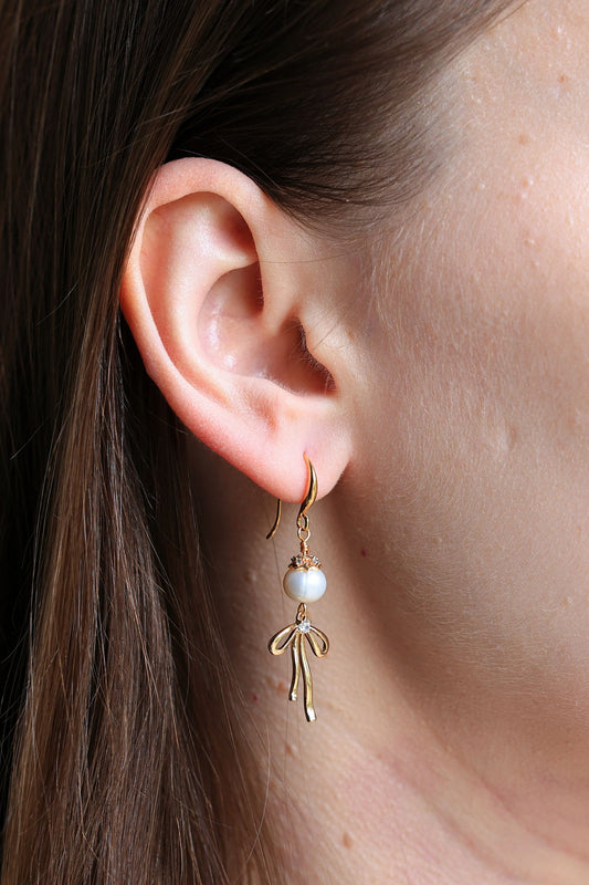 Natural pearls Earrings with a Bow Pendant