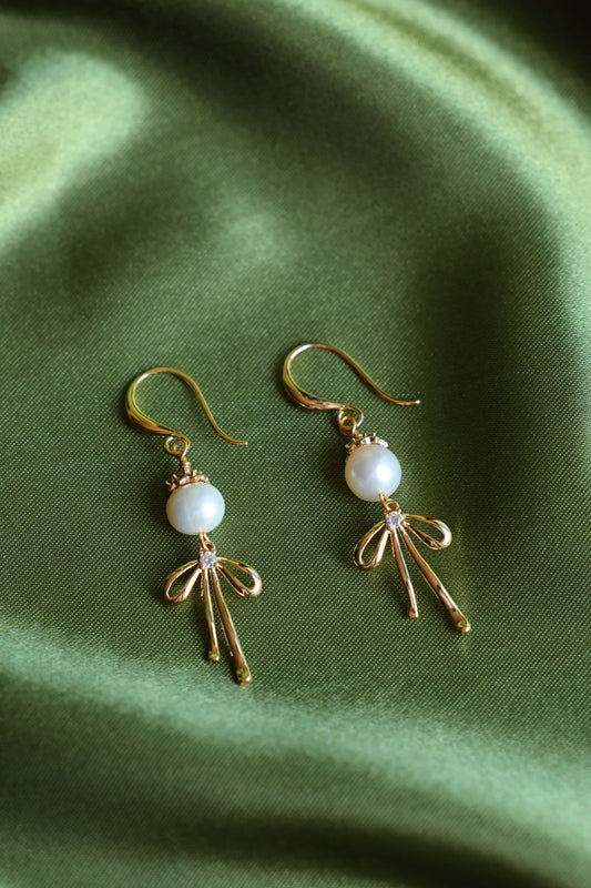 Natural pearls Earrings with a Bow Pendant